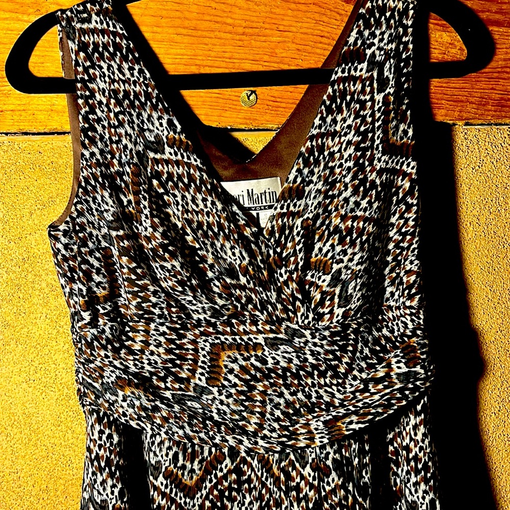 Rich early tribal print dress. Sheer print over brown lining.
